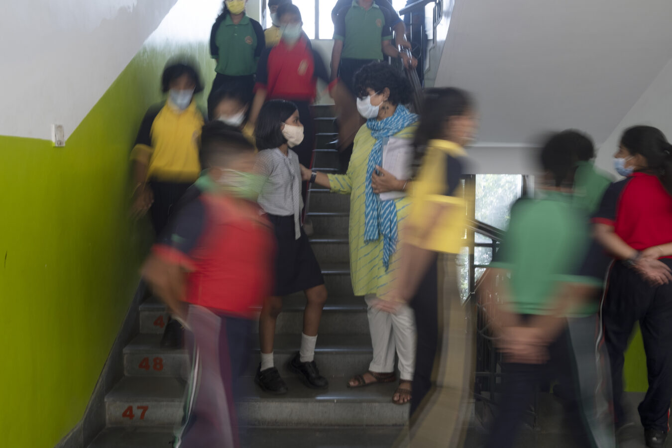 Image of school children and one teacher in India